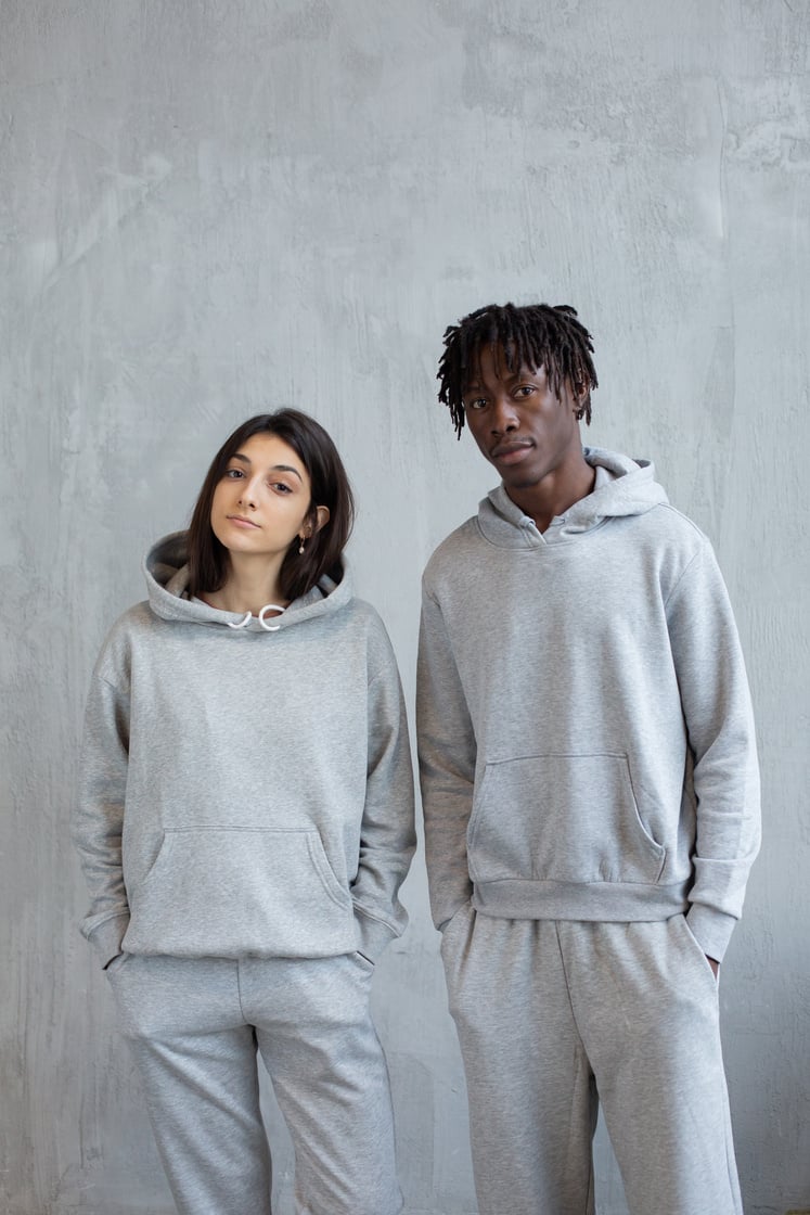 Confident diverse couple in similar clothes